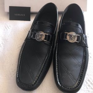 Versace loafers.